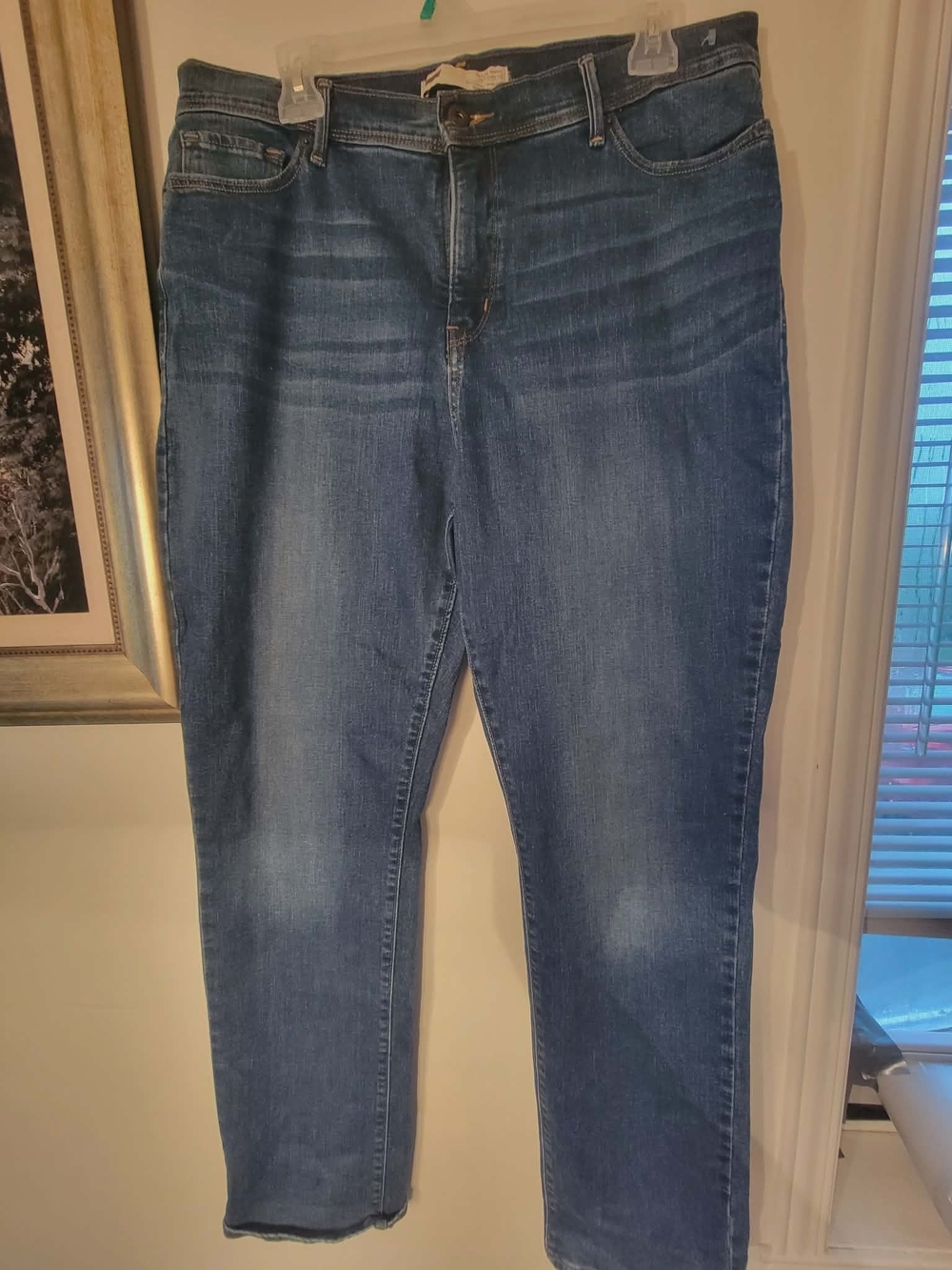 Levi's light blue denim jeans with gold stitching